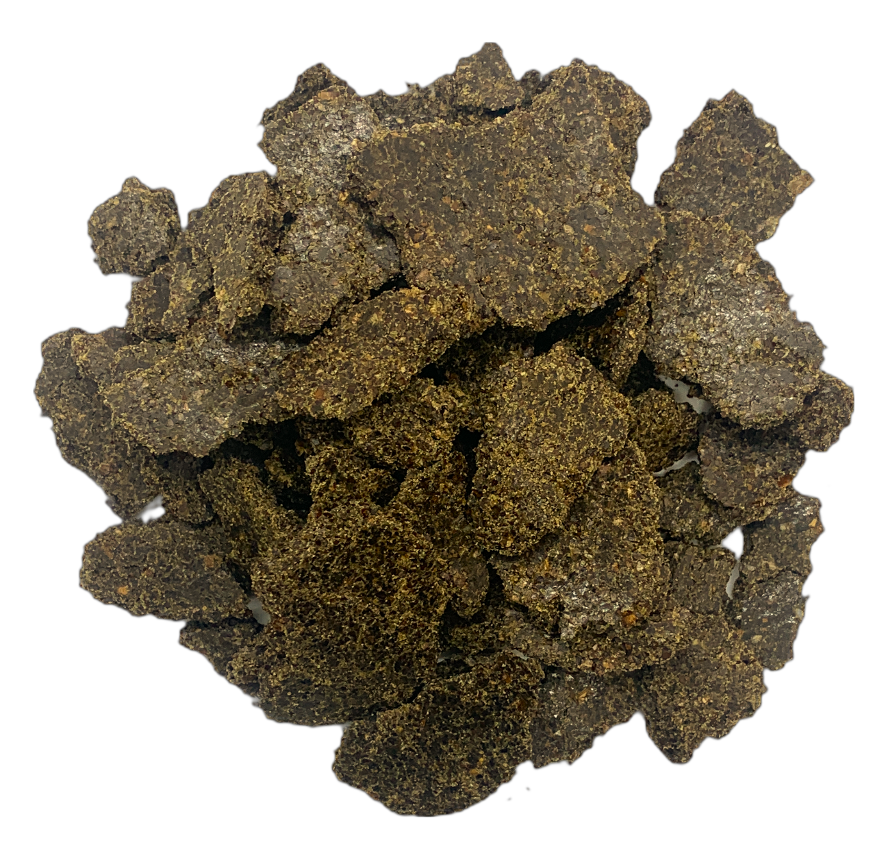 Flakes of pressed hemp cake in a pile on a white background